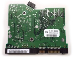 Hard drive PCB back with traces, contacts, solder points