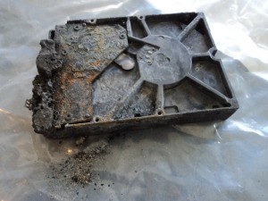 Bottom of fire-damaged hard drive.
