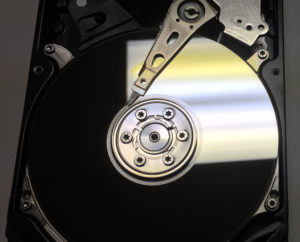 The exposed platters of a hard drive