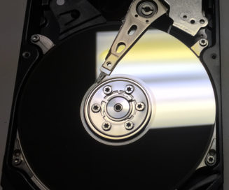 The exposed platters of a hard drive