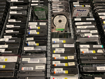 Drawer full of Maxtor and Western Digital hard drives on end
