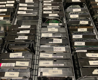 A drawer full of WD hard drives on end